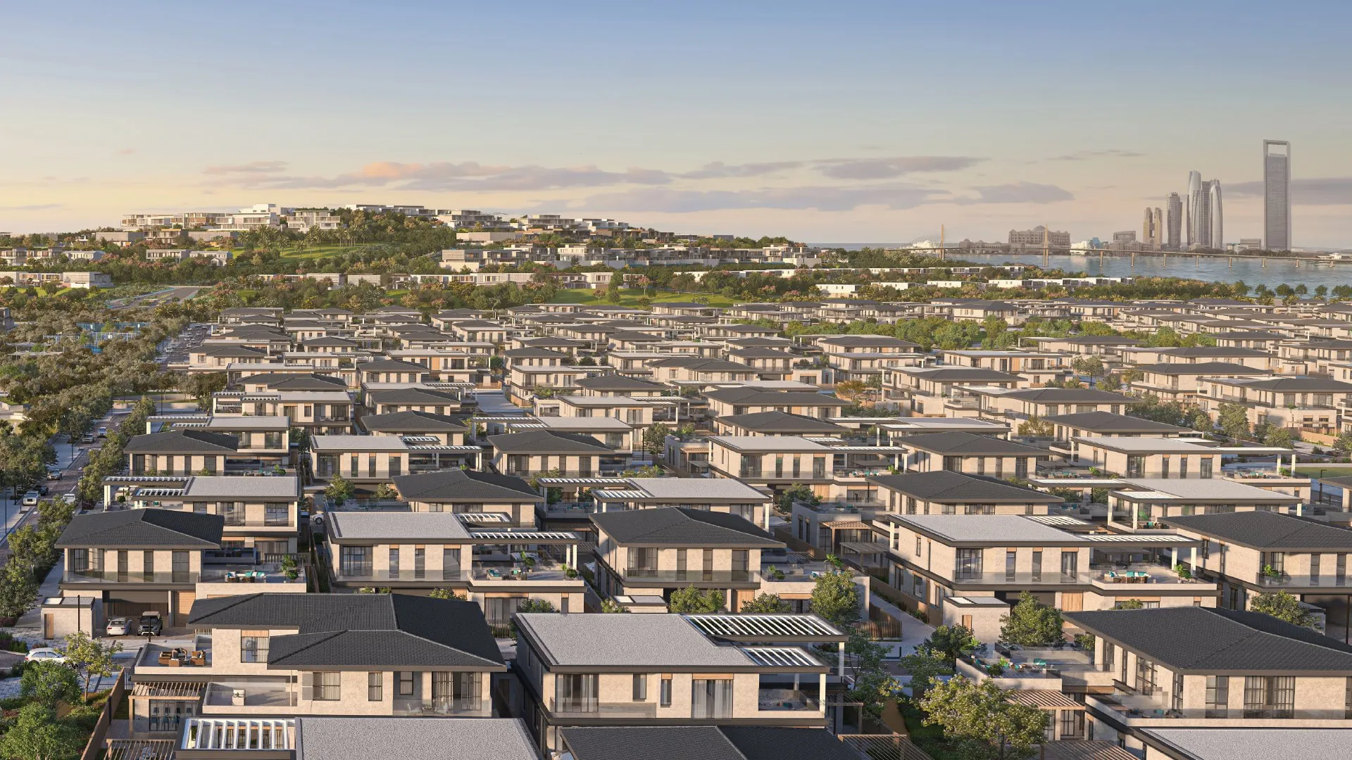 Hillside villas with the Abu Dhabi skyline beyond